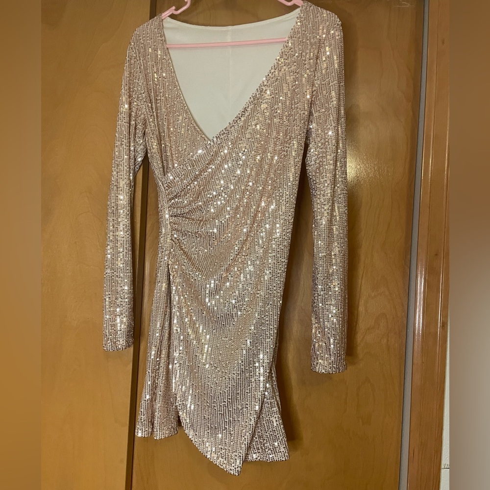 Never worn small champagne sequin wrap dress.